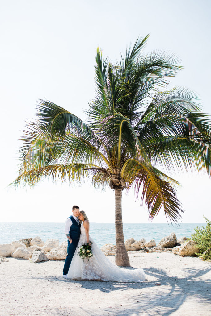 A bride and groom on the beach at their Key West Wedding