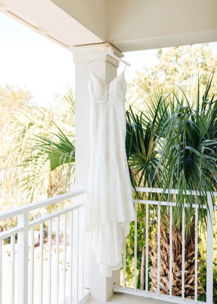 The bride's dress hanging in the hotel room at a Playa Largo Wedding