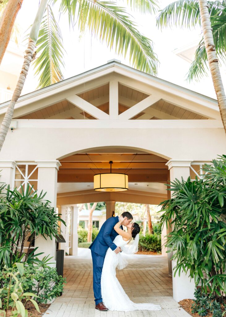 Newlyweds kissing at their Playa Largo wedding venue.