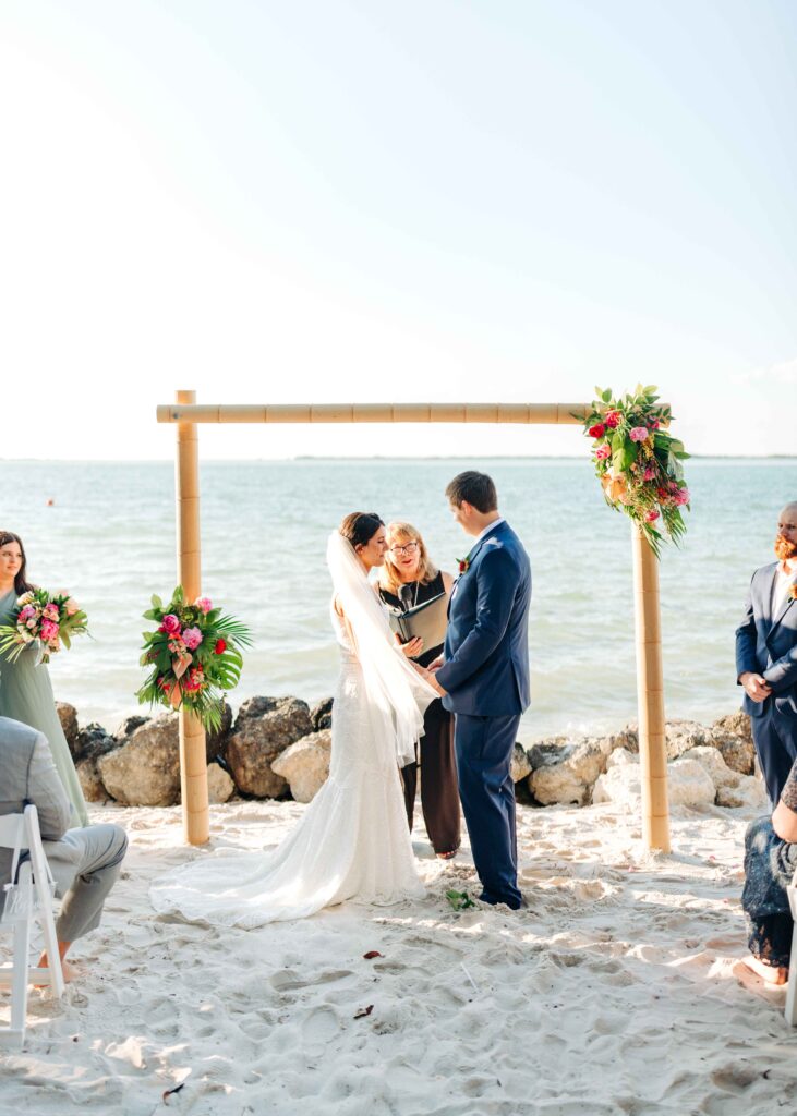 Couple at their wedding ceremony on the beach in Key Largo.