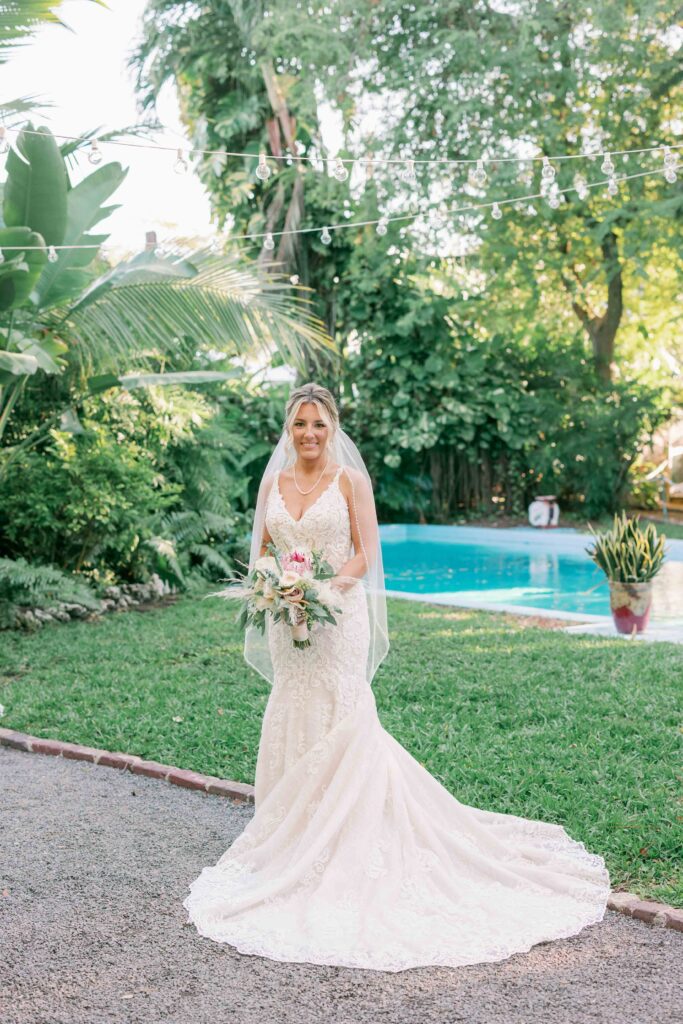 A beautiful bride posing by the pool of The Ernest Hemingway Home in Key West, Florida.