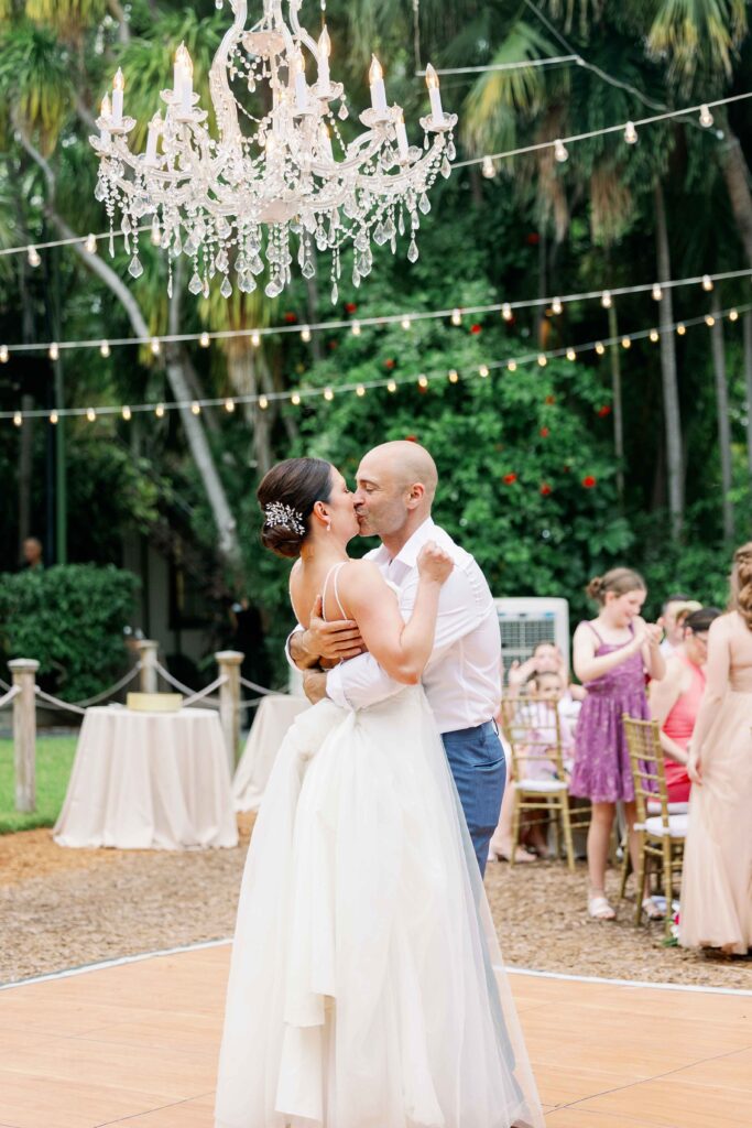 A bride and groom dancing at their Key West wedding reception at The Hemingway Home.