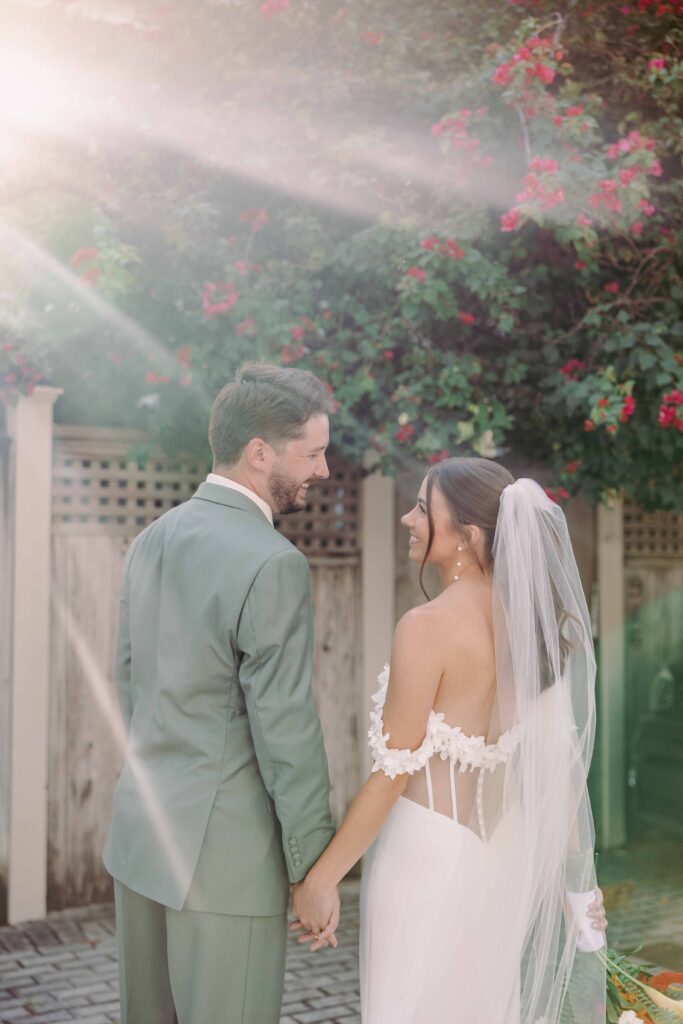 A bride and groom bask in the golden light on their wedding day in the Florida keys.