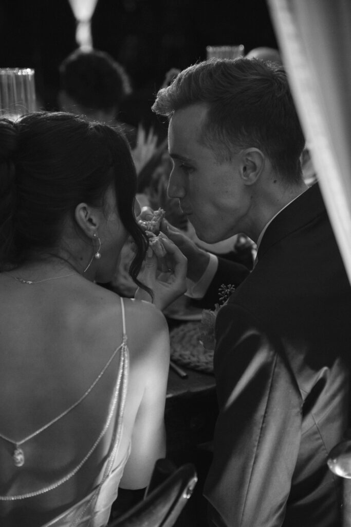 A bride and groom share a bite to eat at their Florida Keys wedding.