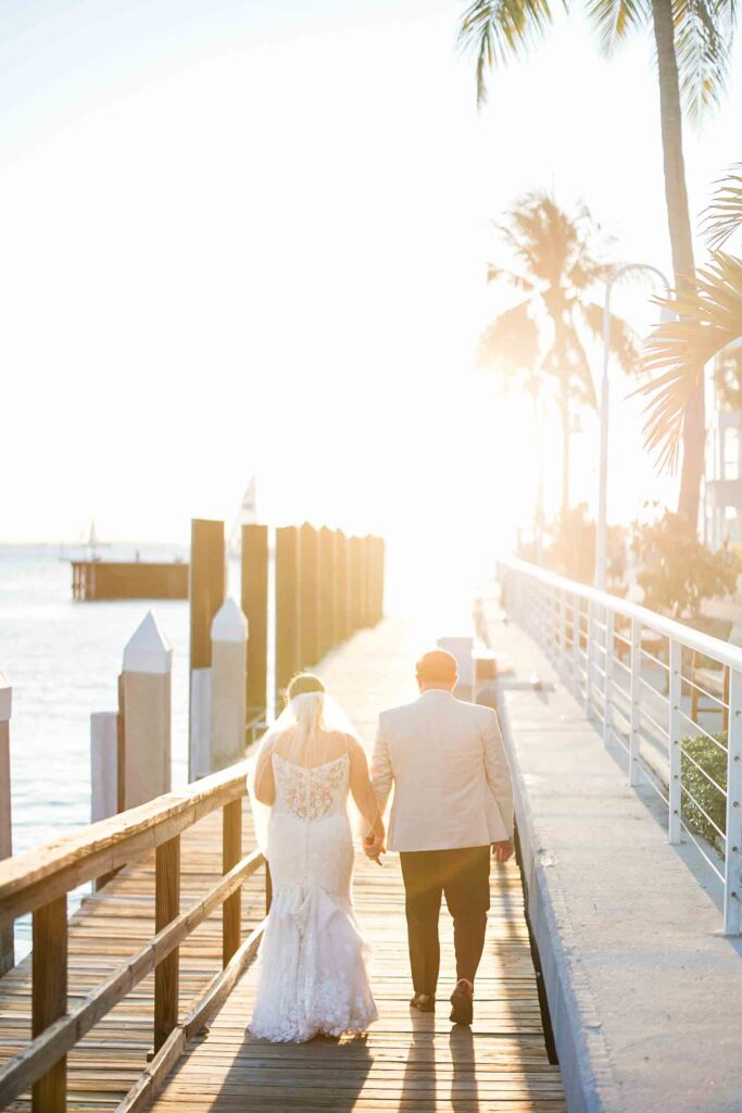 A bride and groom walking the docks of Key West for their wedding portraits.