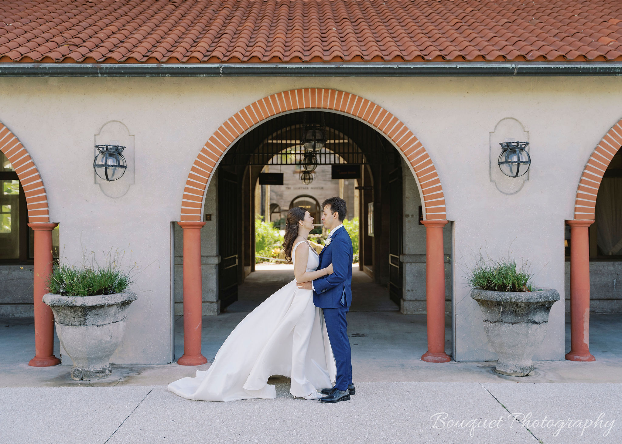 A bride and groom at The Lightner Museum for their St. Augustine wedding.