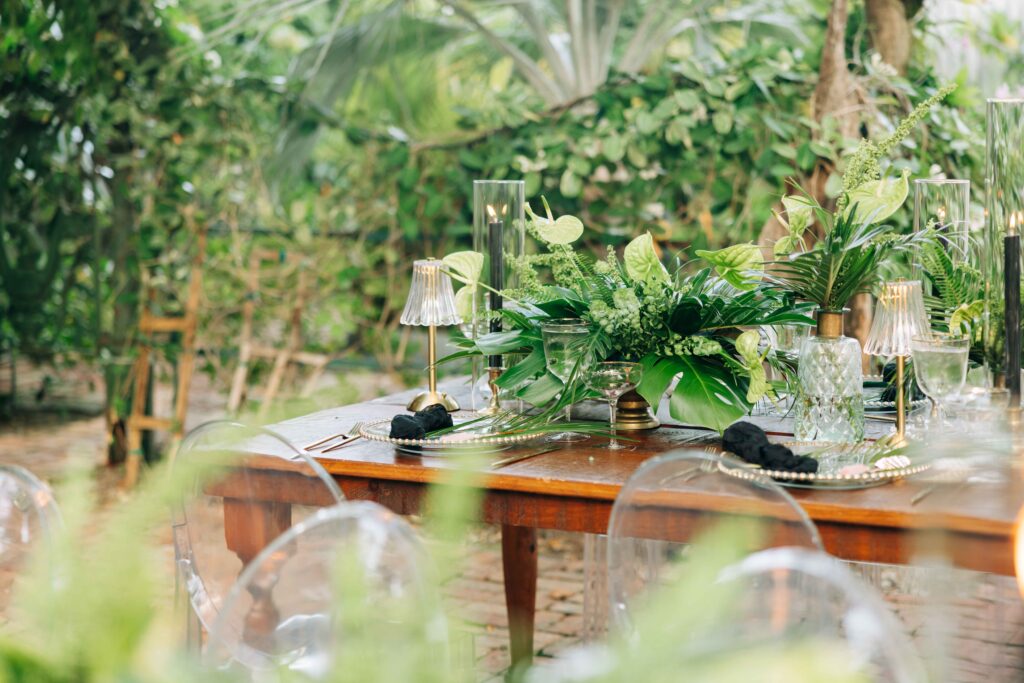 A modern, tropical wedding table set up in the garden of The Audubon House in Key West