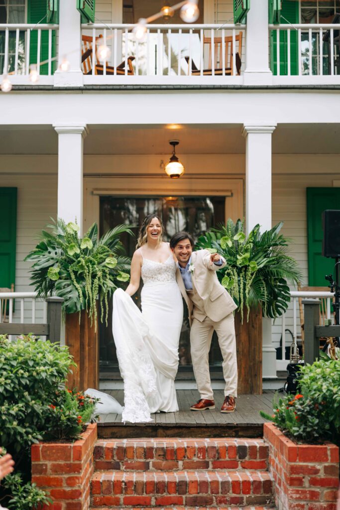 A bride and groom at their wedding ceremony in front of the Audubon House in Key West