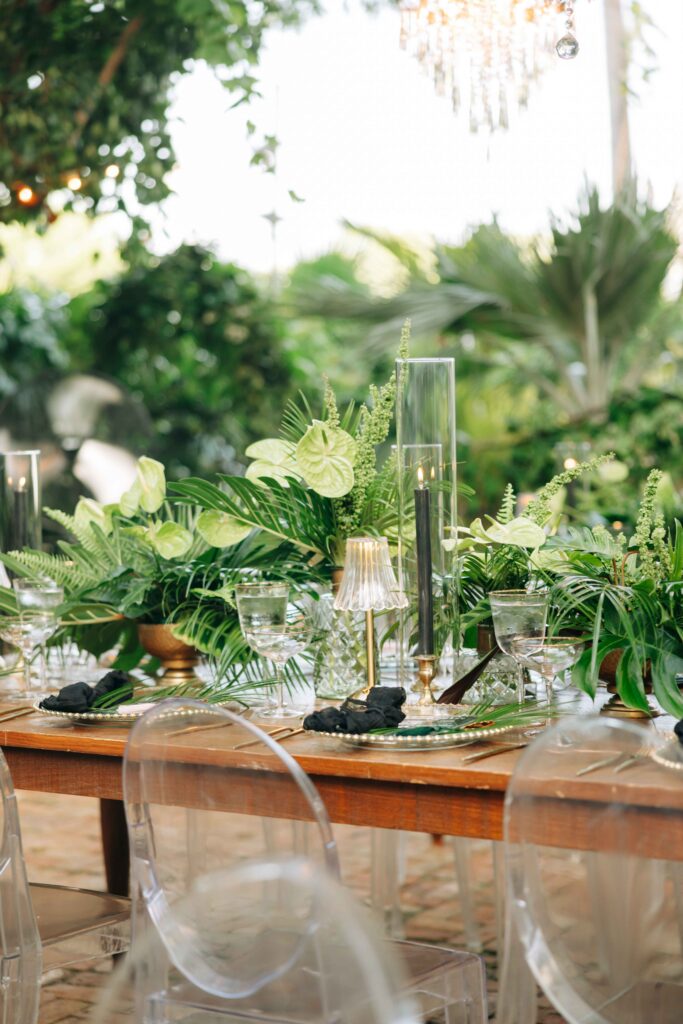 A modern, tropical wedding table set up in the garden of The Audubon House in Key West