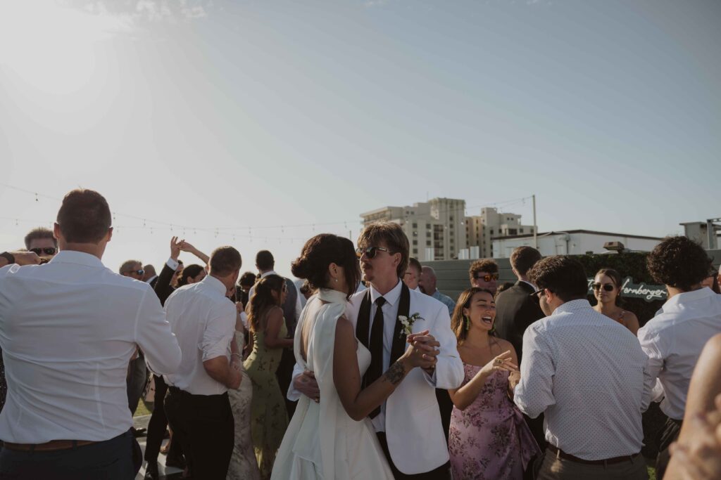 Bride and groom dancing on teh rooftop of Hotel Zamora at their wedding