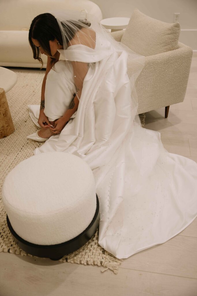 A bride getting dressed and ready for her Hotel Zamora wedding.