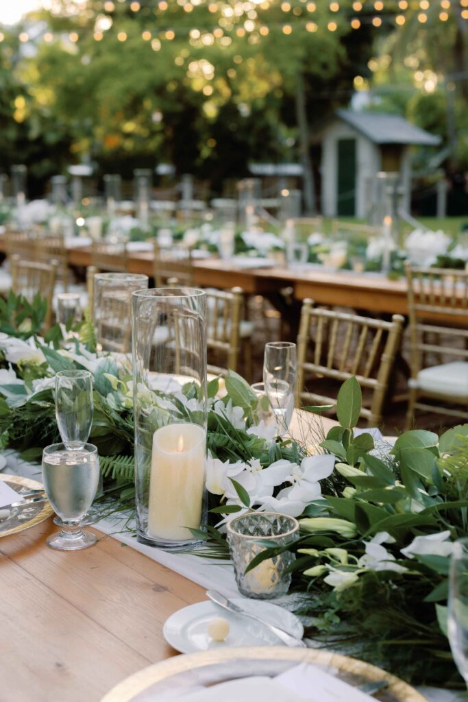 Long tables set up for a wedding in the garden of The Ernest Hemingway Home