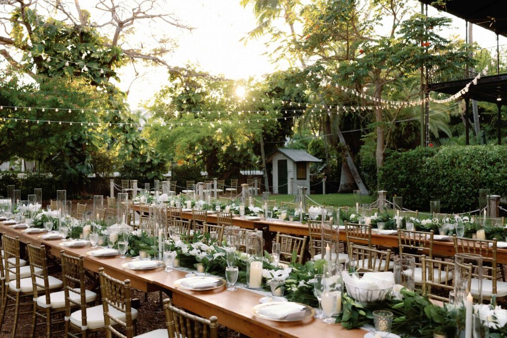 Two long reception tables in the garden of The Ernest Hemingway Home