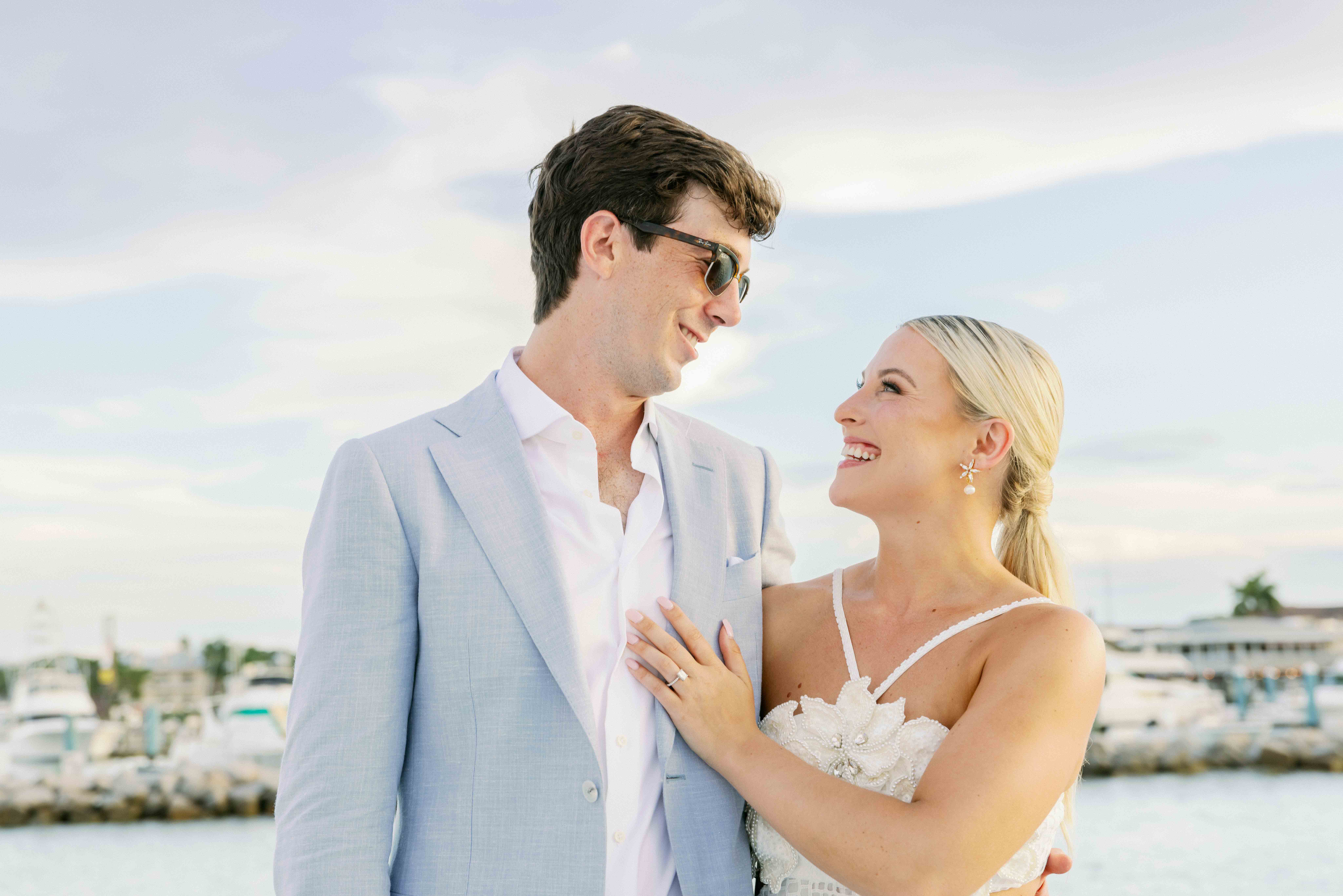 A bride and groom on a sunset cruise at their Key West wedding weekend celebration